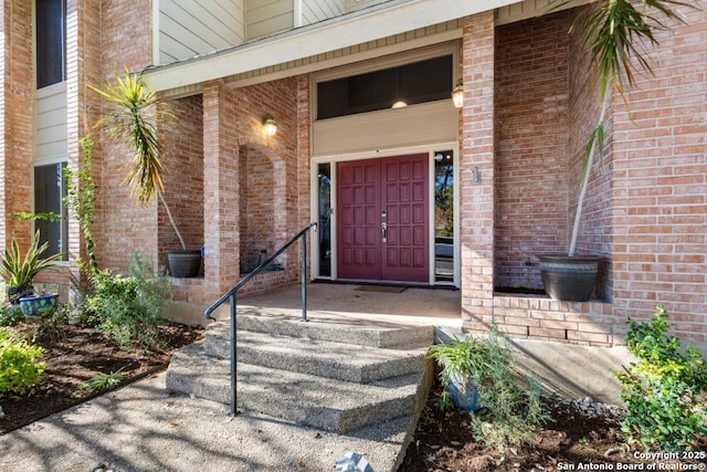 view of exterior entry with covered porch