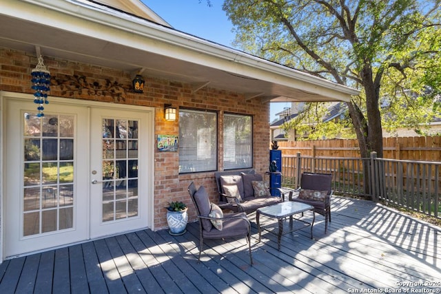 wooden deck featuring an outdoor hangout area