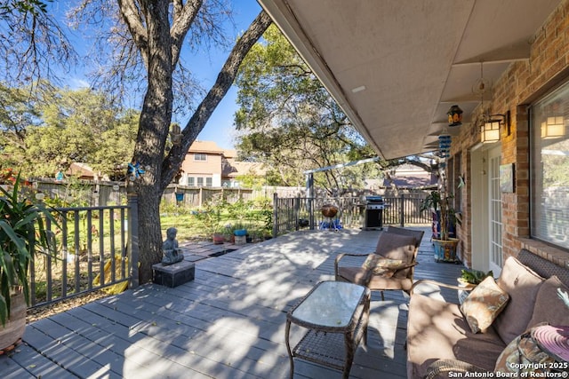 view of patio with an outdoor hangout area and a wooden deck