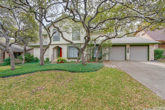 view of front of home with a front yard and a garage