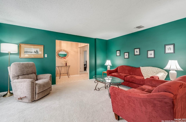 carpeted living room featuring a textured ceiling