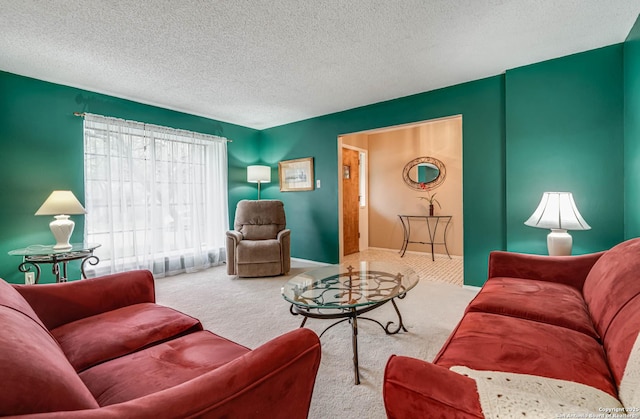 living room with carpet floors and a textured ceiling