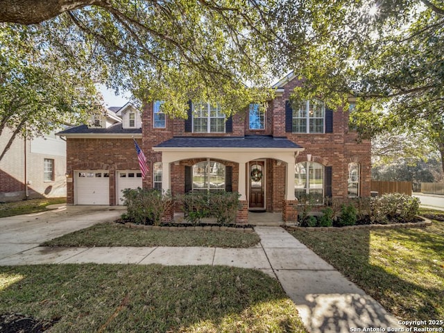 view of front of property featuring a garage and a front lawn