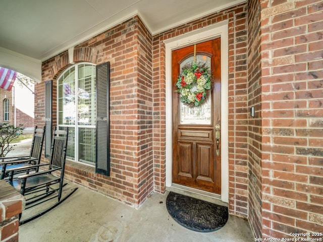 doorway to property with a porch