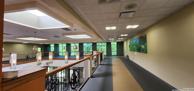 corridor featuring a paneled ceiling