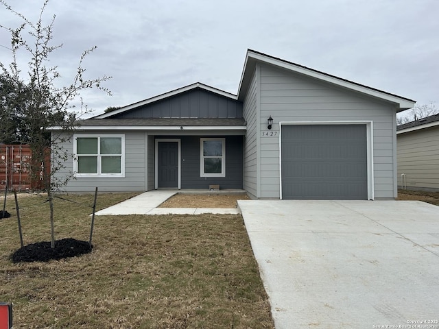 ranch-style home featuring a garage and a front yard