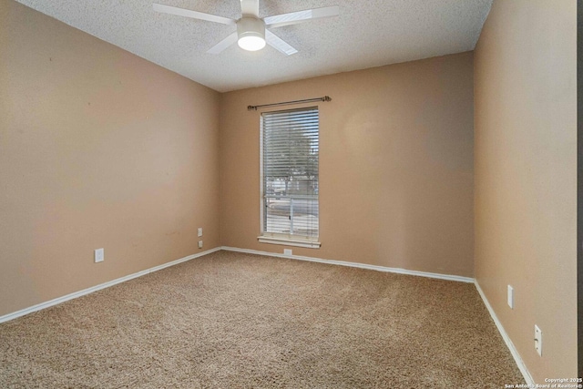 carpeted empty room with ceiling fan and a textured ceiling