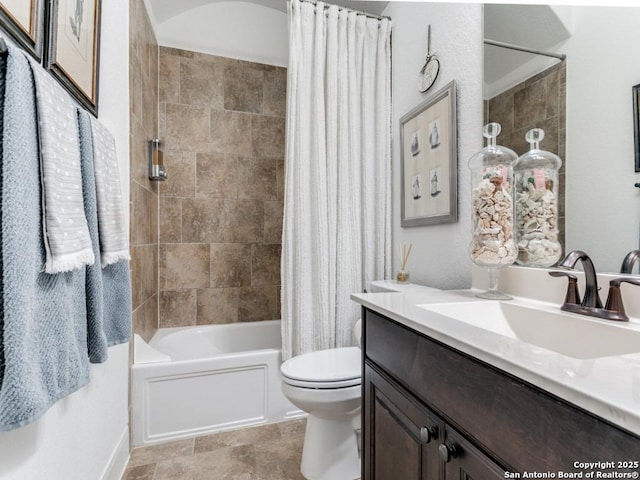 full bathroom with vanity, toilet, and shower / tub combo with curtain