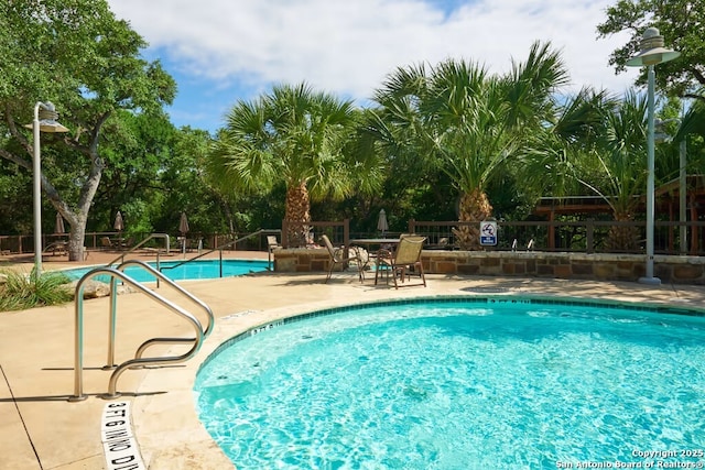 view of swimming pool featuring a patio