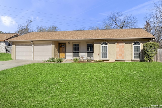 single story home with a garage and a front lawn