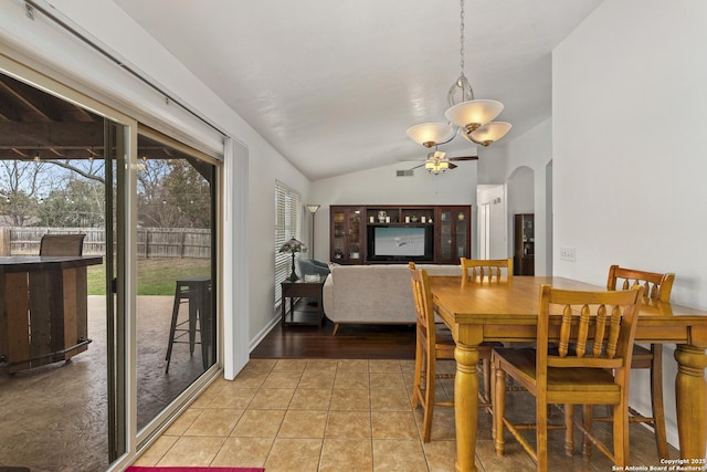 tiled dining area featuring plenty of natural light, ceiling fan, and lofted ceiling