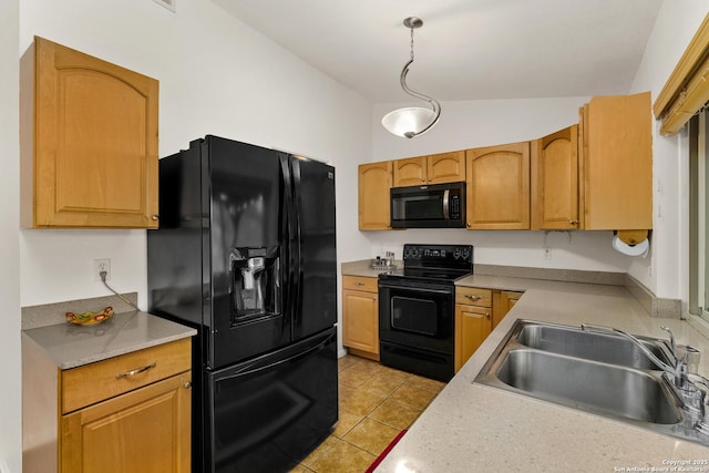 kitchen with light tile patterned flooring, sink, hanging light fixtures, and black appliances