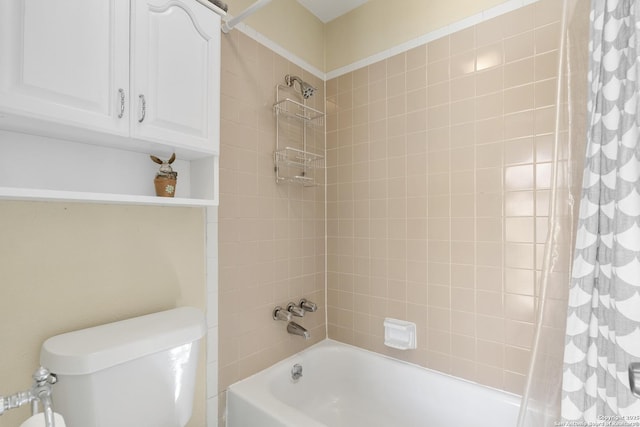 bathroom with shower / bath combo with shower curtain and toilet