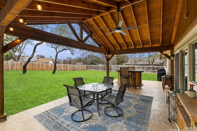 view of patio / terrace with ceiling fan and a grill