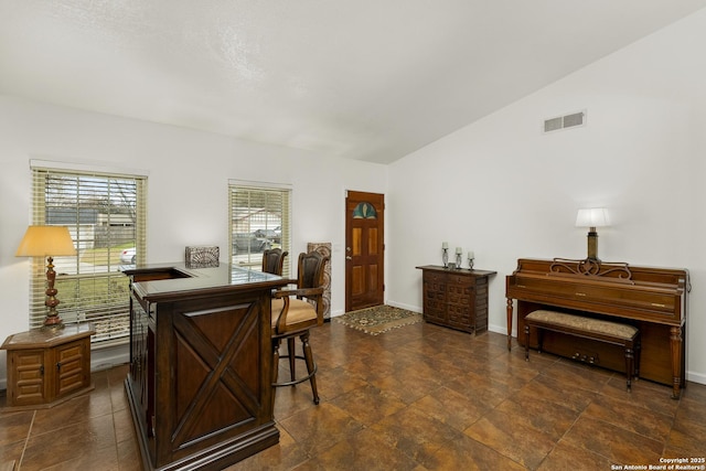 interior space featuring vaulted ceiling