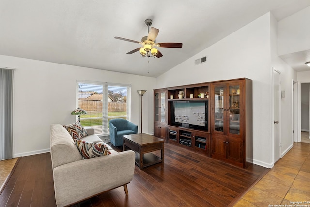 living room with ceiling fan, wood-type flooring, and lofted ceiling