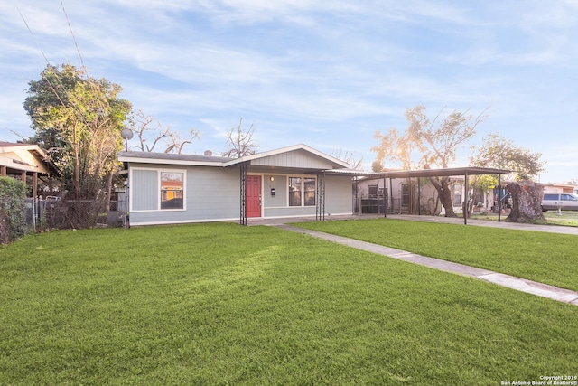 single story home with a carport and a front yard