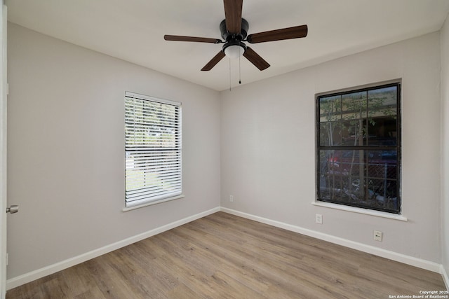 unfurnished room featuring ceiling fan and light hardwood / wood-style flooring