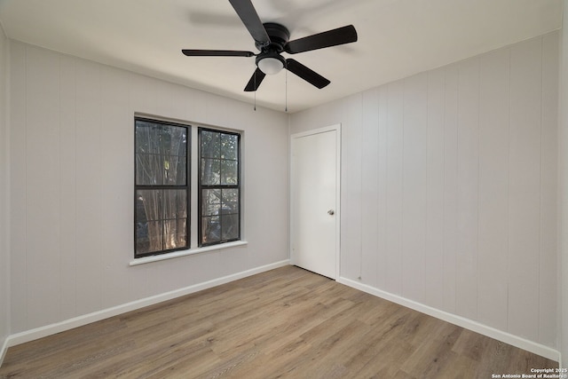 spare room featuring ceiling fan and light hardwood / wood-style flooring