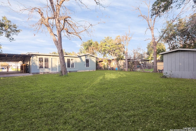 view of yard featuring a carport