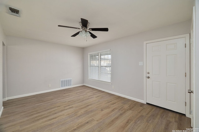 entryway with ceiling fan and light hardwood / wood-style floors