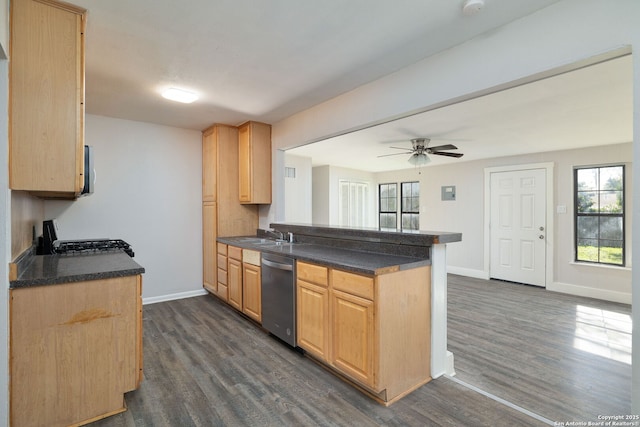 kitchen featuring dishwasher, range, dark wood-type flooring, and kitchen peninsula