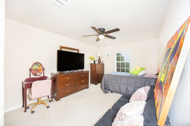 bedroom featuring ceiling fan and light carpet