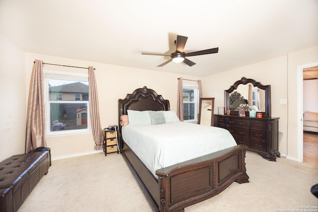 bedroom featuring ceiling fan and light colored carpet