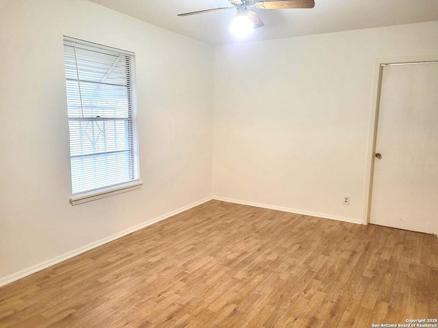 empty room with light hardwood / wood-style flooring and ceiling fan