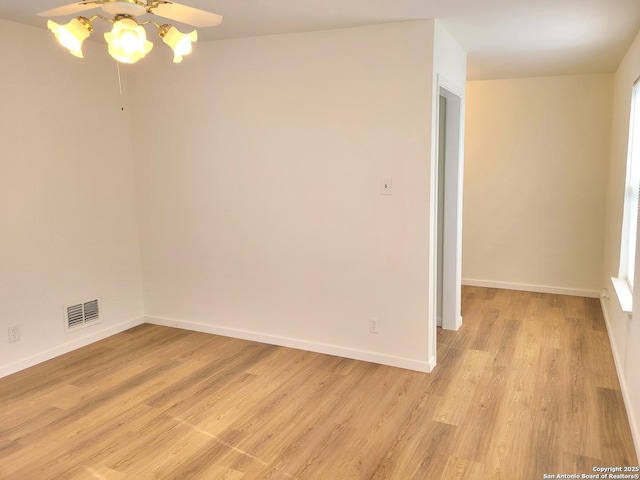 unfurnished room featuring light wood-type flooring and ceiling fan