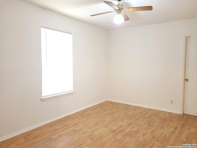 unfurnished room featuring ceiling fan and light hardwood / wood-style floors