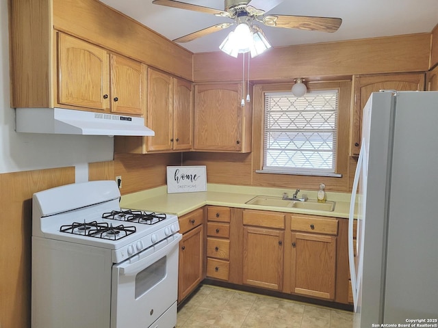 kitchen with ceiling fan, white appliances, and sink