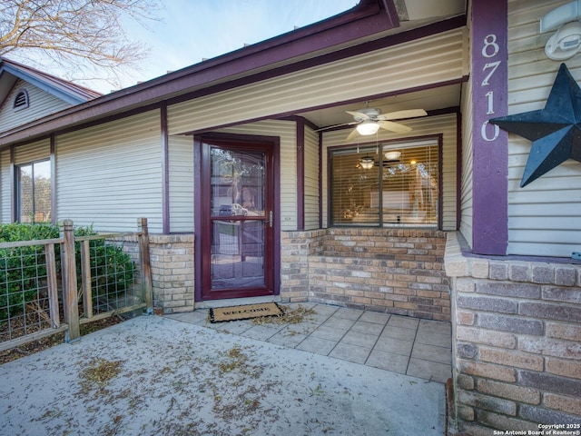 view of exterior entry with a porch