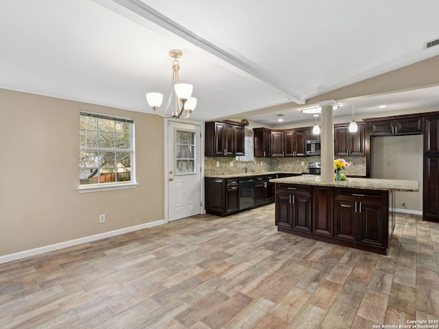 kitchen featuring decorative light fixtures, lofted ceiling with beams, light stone counters, and dark brown cabinets