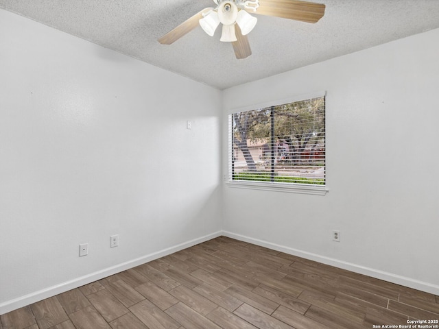 empty room featuring hardwood / wood-style flooring, ceiling fan, and a textured ceiling