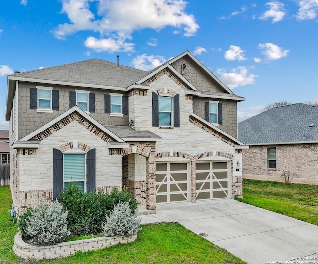 view of front of home featuring a garage and a front lawn