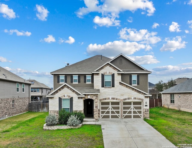 craftsman house with a garage and a front lawn