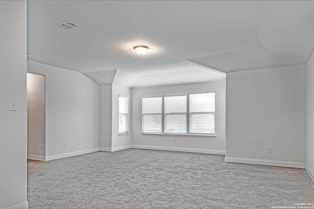 empty room featuring light carpet