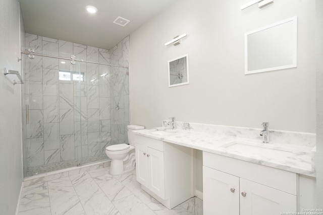 bathroom with vanity, an enclosed shower, and toilet