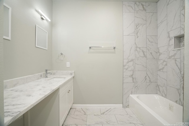 bathroom with vanity and tiled shower / bath combo