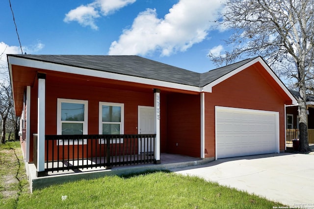 view of front of property with covered porch and a garage