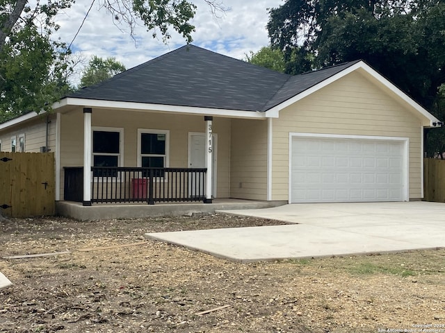 view of front of home with covered porch and a garage