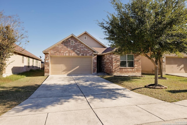 view of front facade with a front yard and a garage