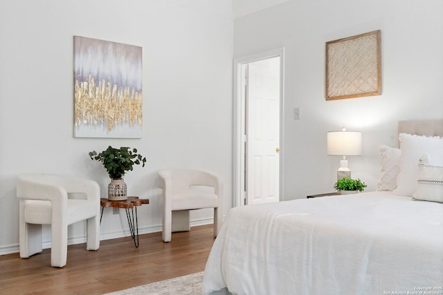 bedroom with light hardwood / wood-style floors