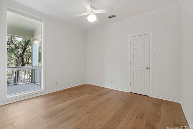 empty room with light wood-type flooring, ceiling fan, and crown molding