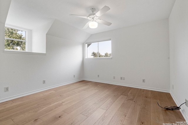 bonus room with ceiling fan, vaulted ceiling, and light wood-type flooring