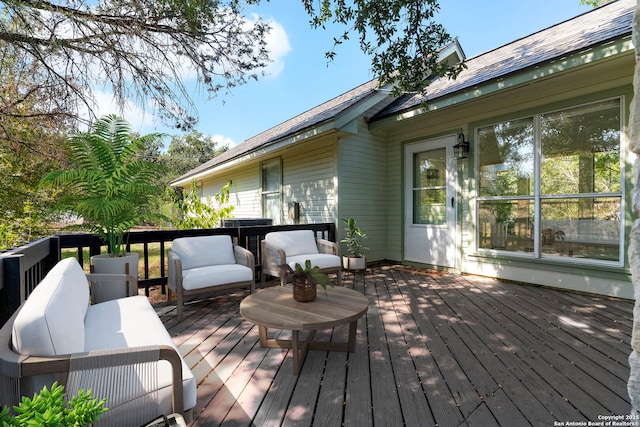 wooden terrace featuring outdoor lounge area