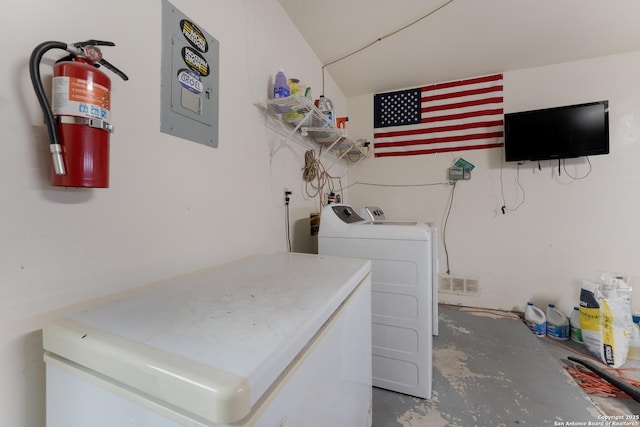 clothes washing area with washer and clothes dryer