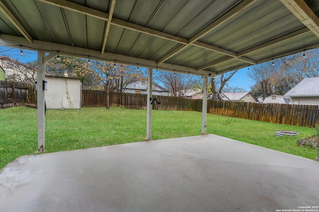 view of patio featuring a shed