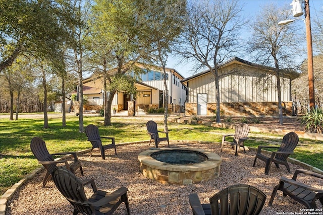 view of yard featuring an outdoor fire pit